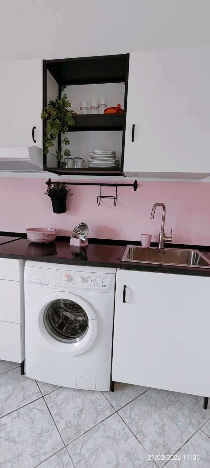 Kitchen or kitchenette, washing machine