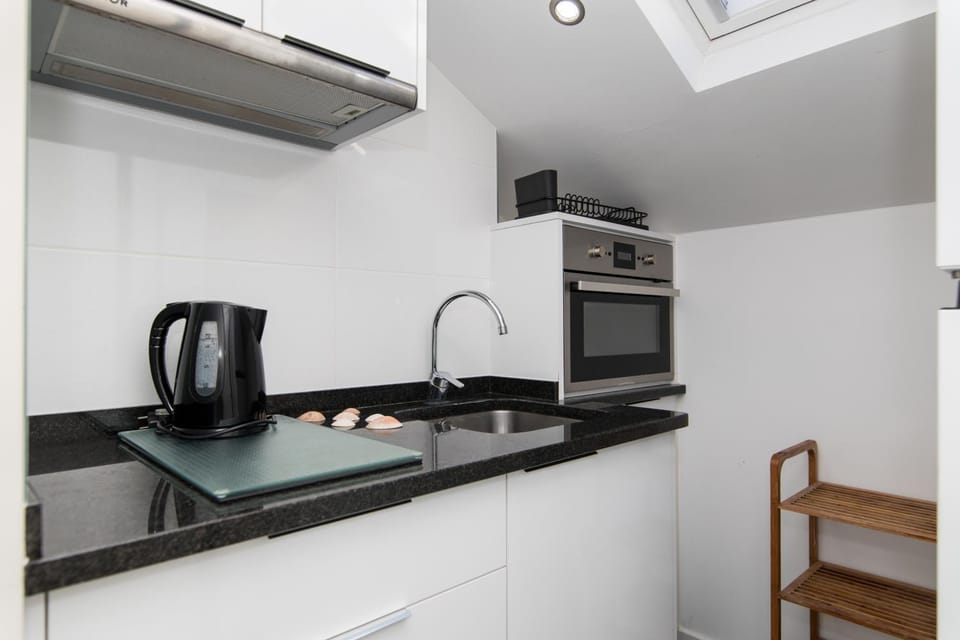 Kitchen or kitchenette, oven, stove