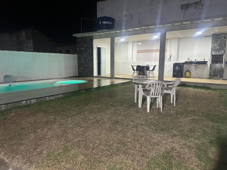 Patio, Night, Dining area, Pool view, Swimming pool