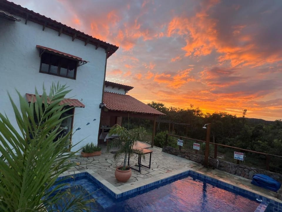 Property building, Patio, Natural landscape, Pool view, Swimming pool, Sunrise, Sunset, sunbed