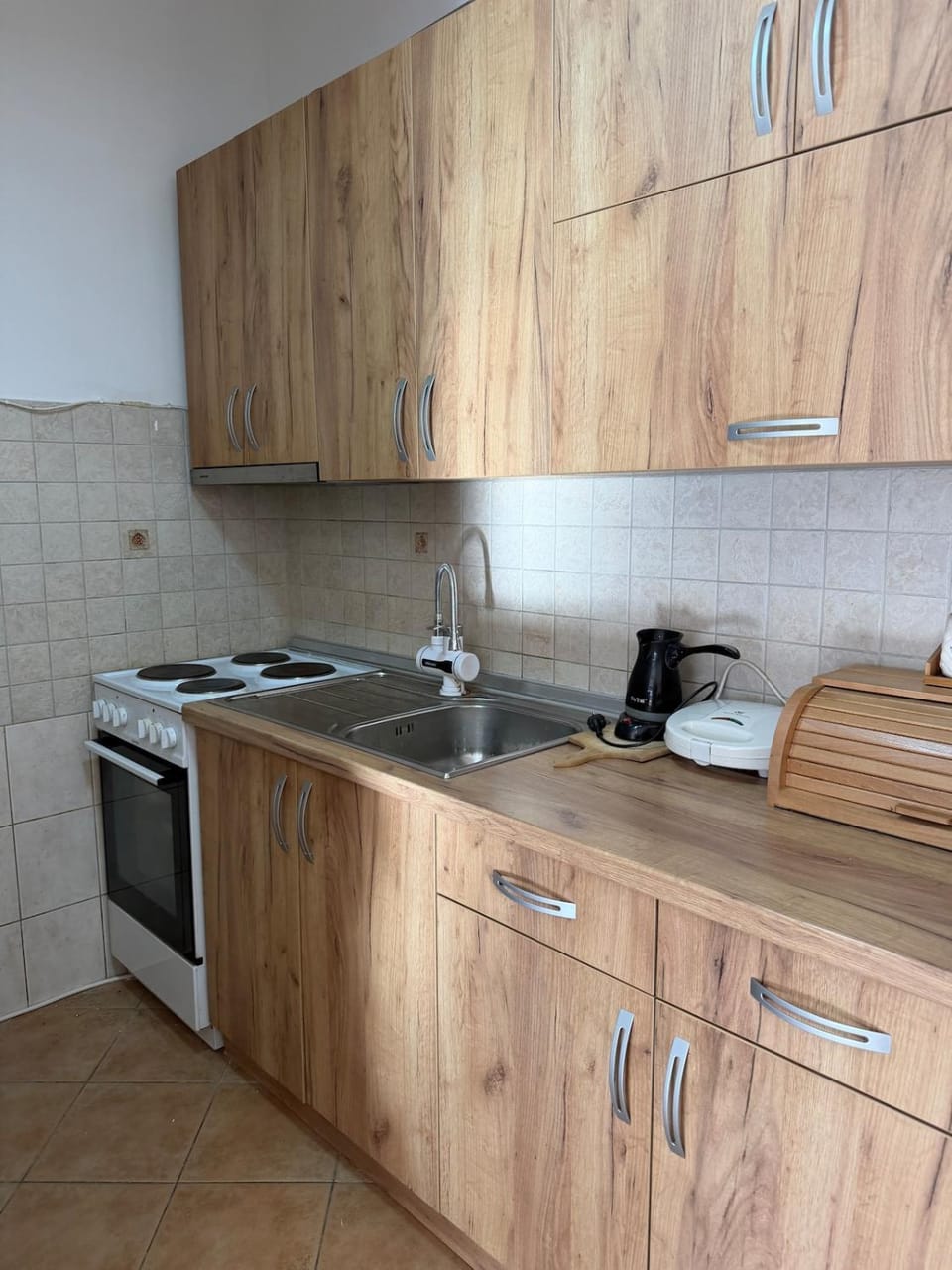 Kitchen or kitchenette, stove, toaster