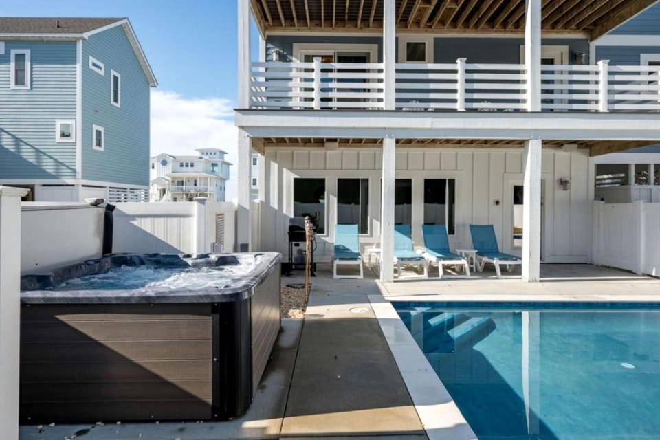 Spacious Coastal Retreat with Pool, Hot Tub, Game Room & Private Balconies in Corolla, North Carolina House in Corolla