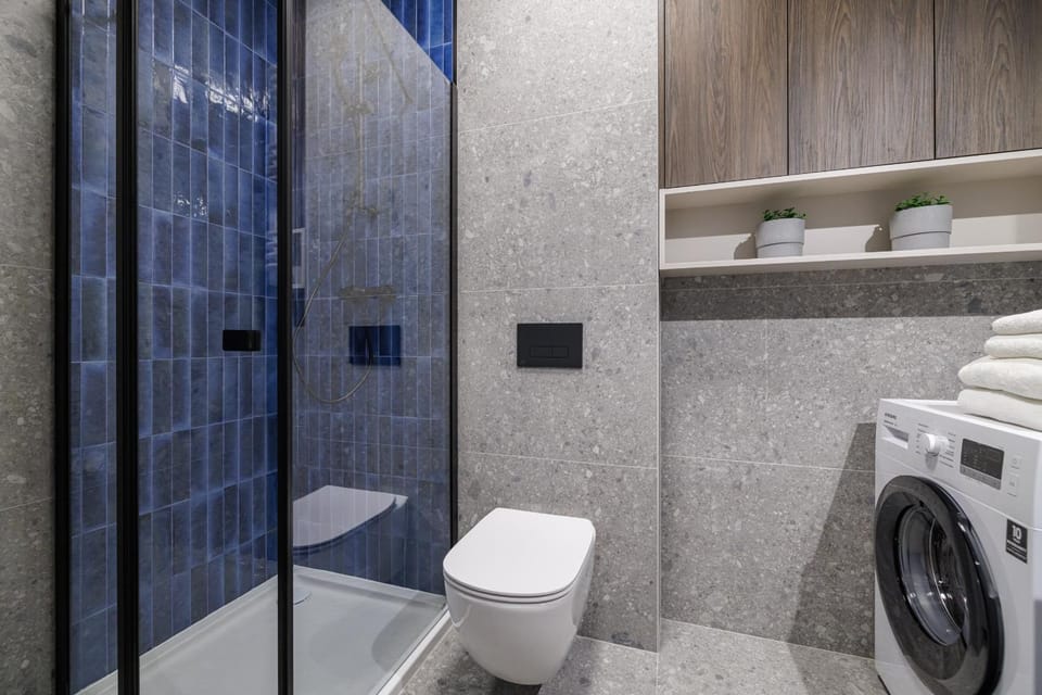 Shower, Toilet, Bathroom, towels, washing machine, dryer