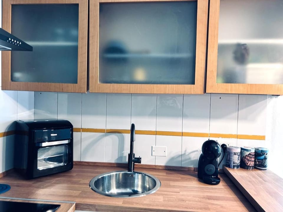 Kitchen or kitchenette, stove