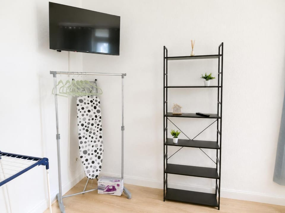 Communal lounge/ TV room, TV and multimedia, Decorative detail, Decorative detail, flat iron, furniture, wardrobe
