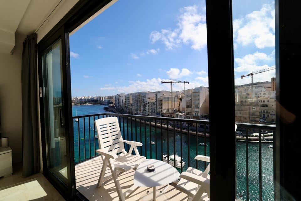 Property building, Day, View (from property/room), Balcony/Terrace, Living room, Seating area, Sea view