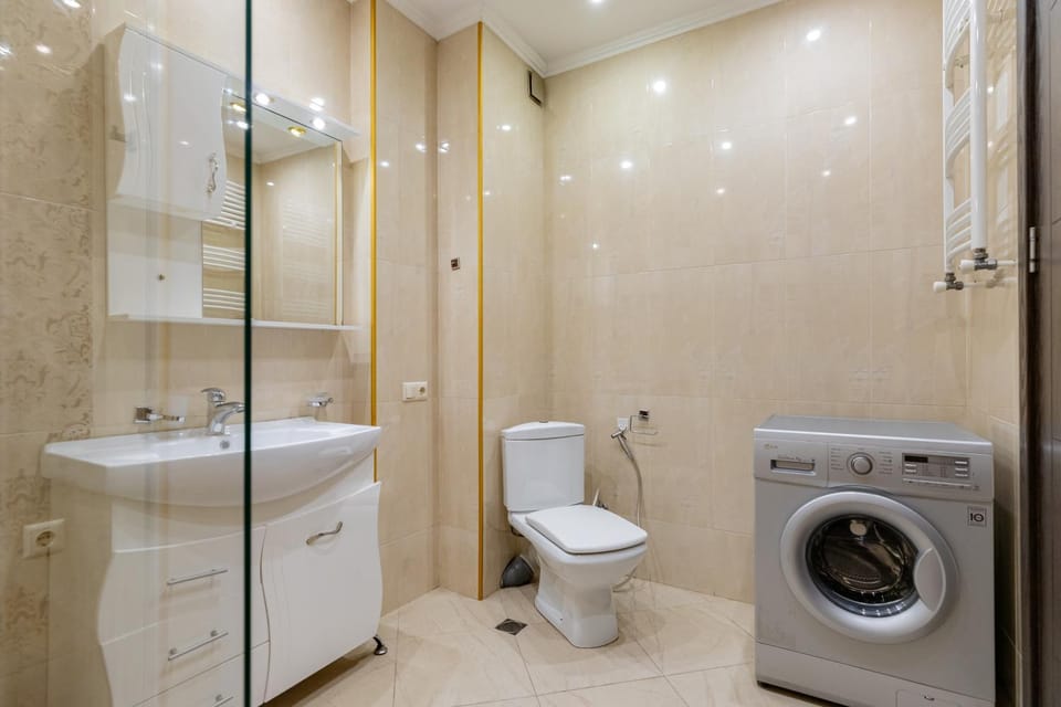 Shower, Toilet, Bathroom, towels, washing machine, dryer