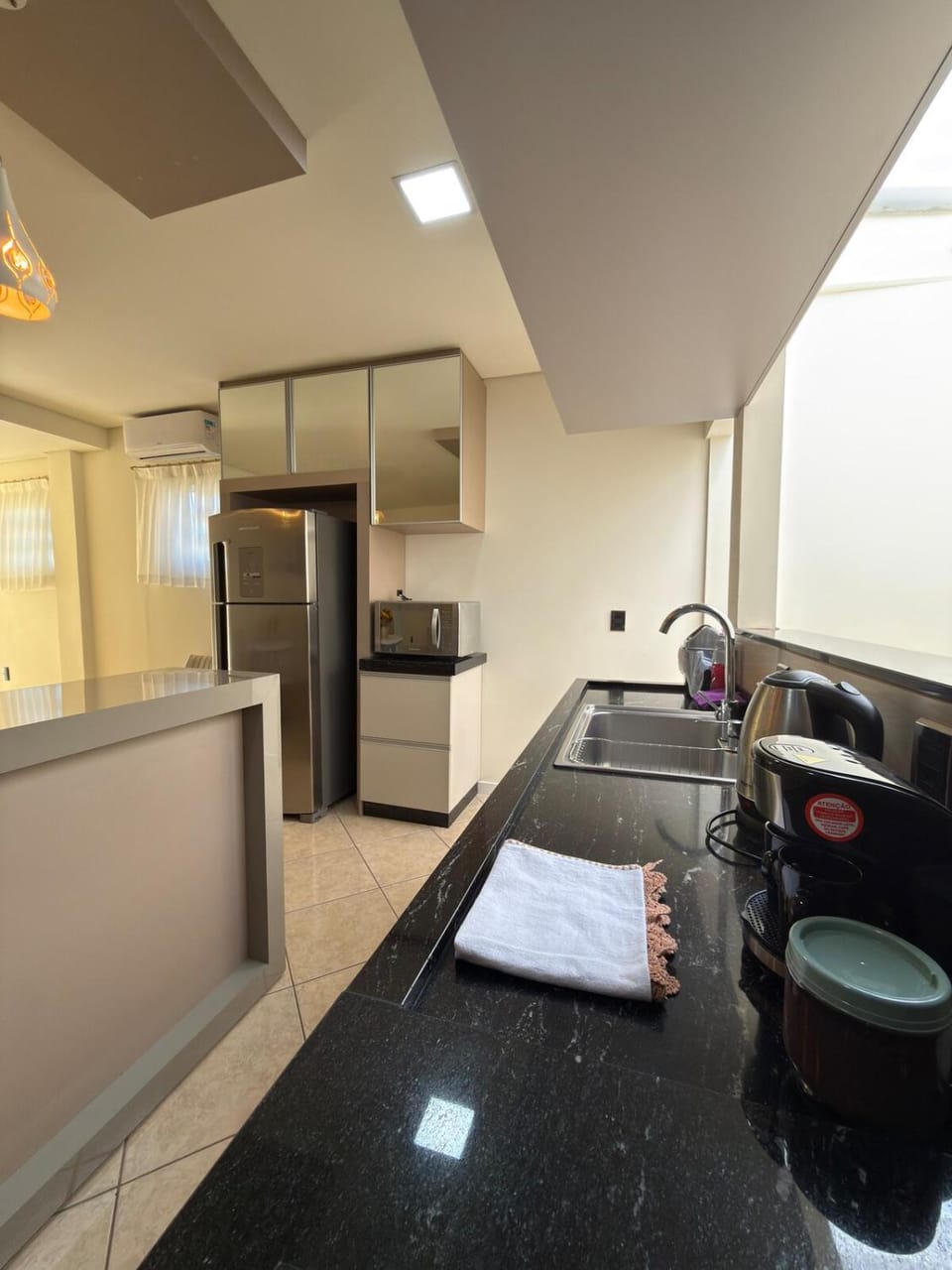 Kitchen or kitchenette, dishwasher, oven, stove, toaster