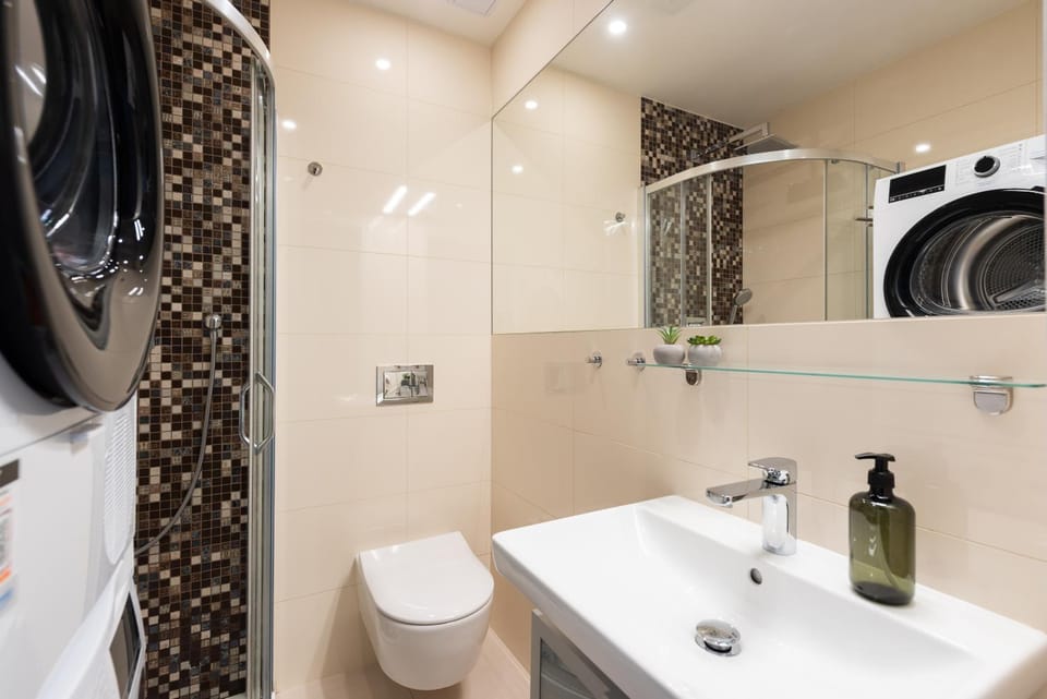 Shower, Toilet, Bathroom, towels, washing machine, dryer
