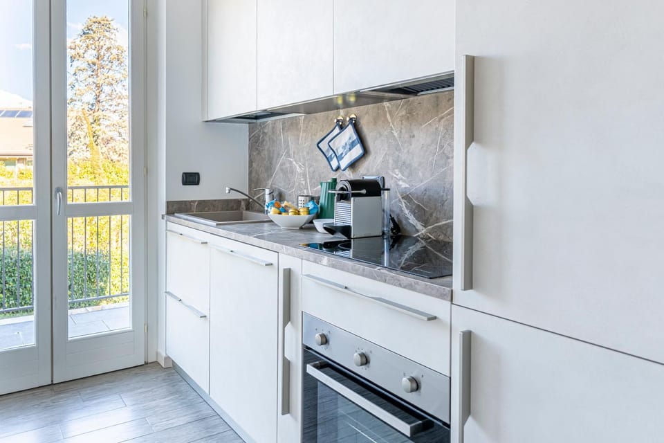 Kitchen or kitchenette, dishwasher, oven, stove