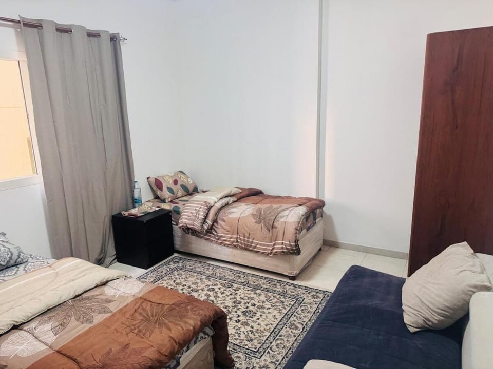 Double Room shared bathroom Apartment in Al Sharjah