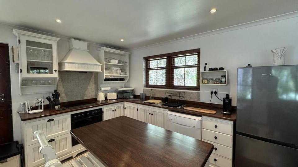 Kitchen or kitchenette, dishwasher, oven, stove