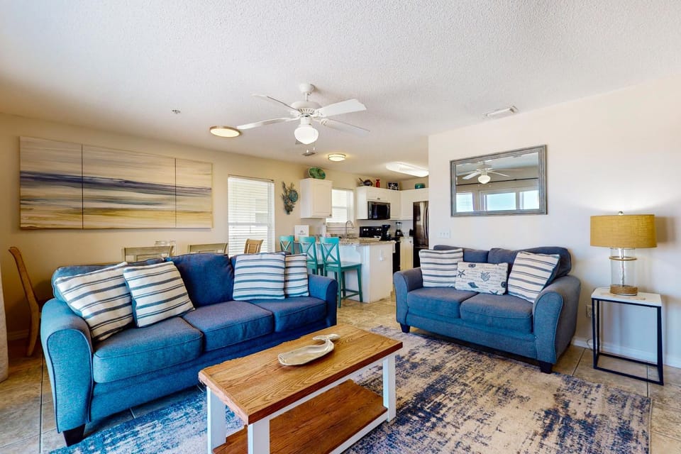 Bright condo with shared pool beach access & central location House in Pensacola Beach