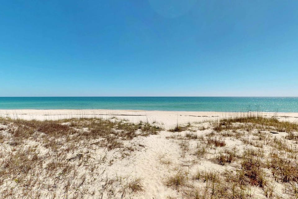 Beachfront home with elevator beach gear on-site neiborhood pool tennis & fitness room House in Saint George Island