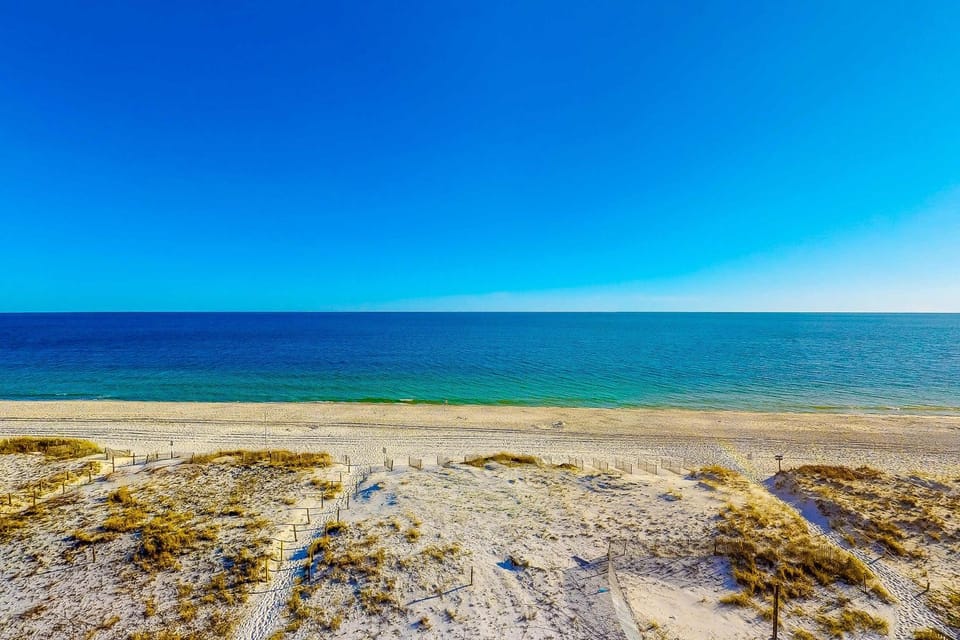 Beachfront Condo with Shared Outdoor Pool Central AC Private Balcony Views WiFi House in West Beach