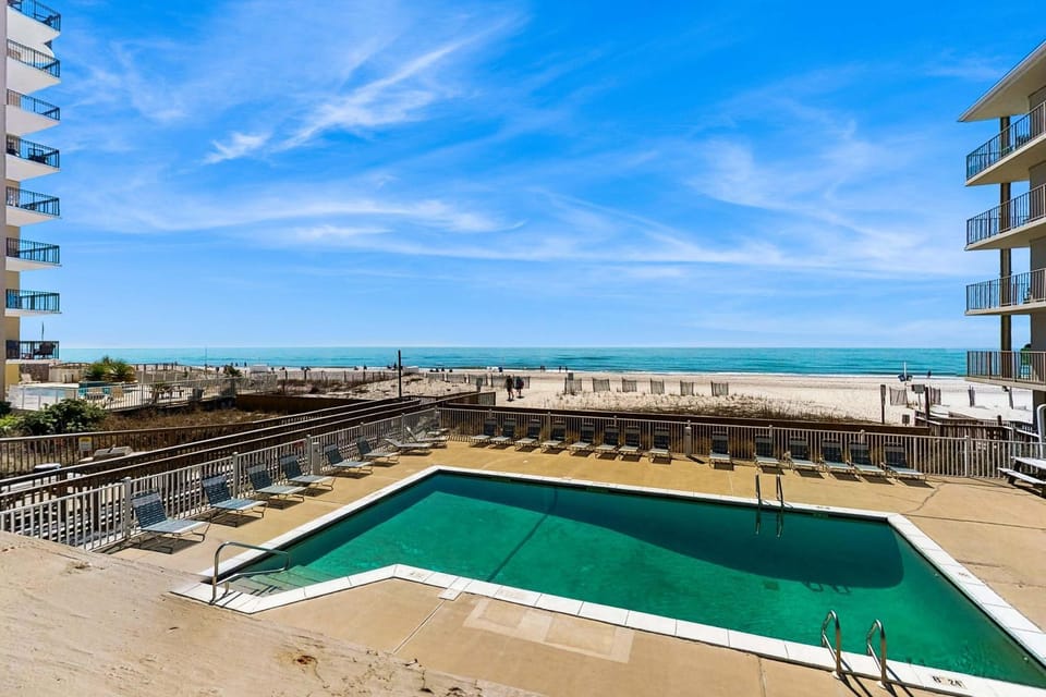 Ocean-view condo with pool access outdoor seating central AC & WiFi House in West Beach