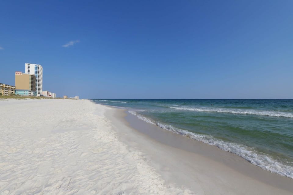 Waterfront condo with a furnished balcony peek-a-boo Gulf views & shared pools House in West Beach