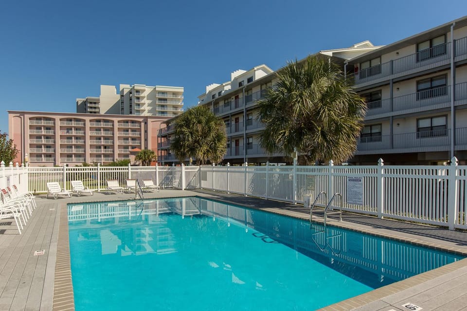 Condo with partial Gulf views shared outdoor pool sun deck & private beach access House in Orange Beach