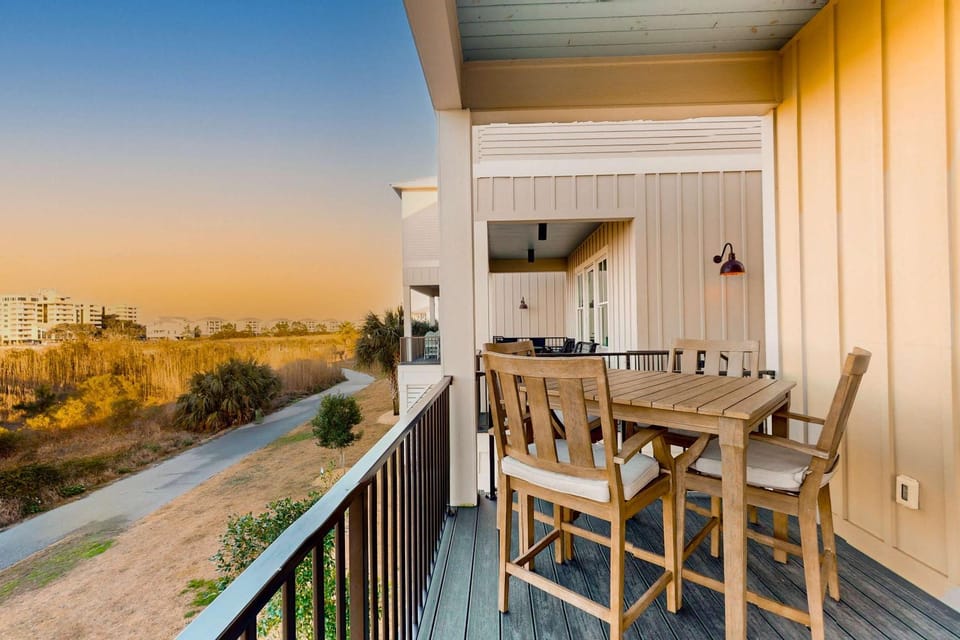 Pristine waterfront escape just steps to beach with community pool washer dryer House in West Beach