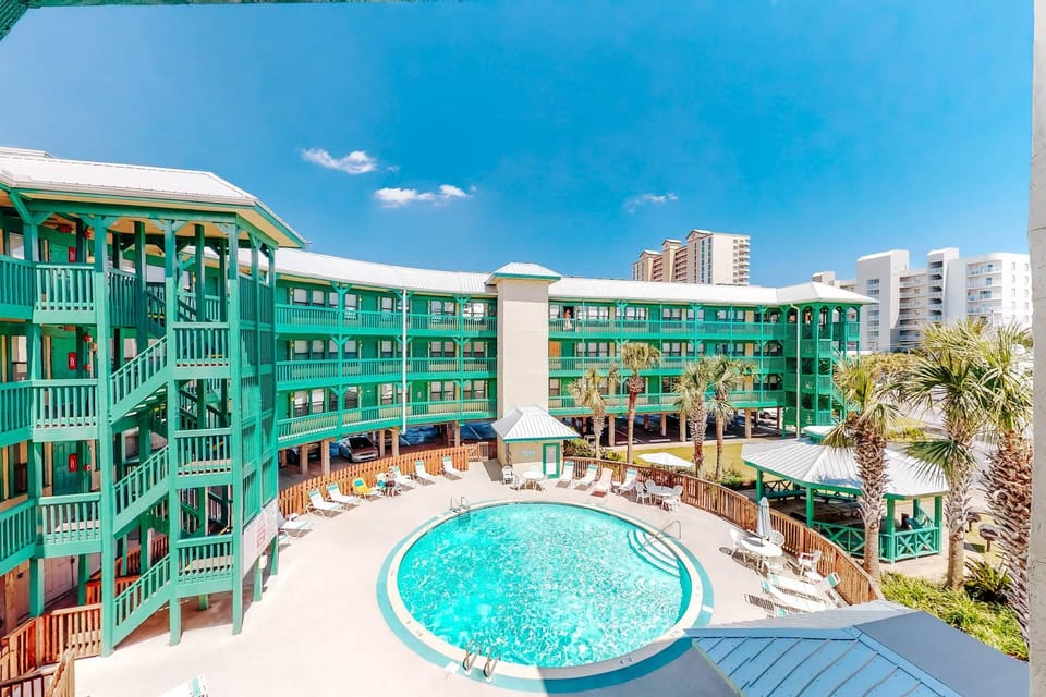 Coastal condo just steps from the beach w shared pool BBQ area WiFi AC W&D House in West Beach