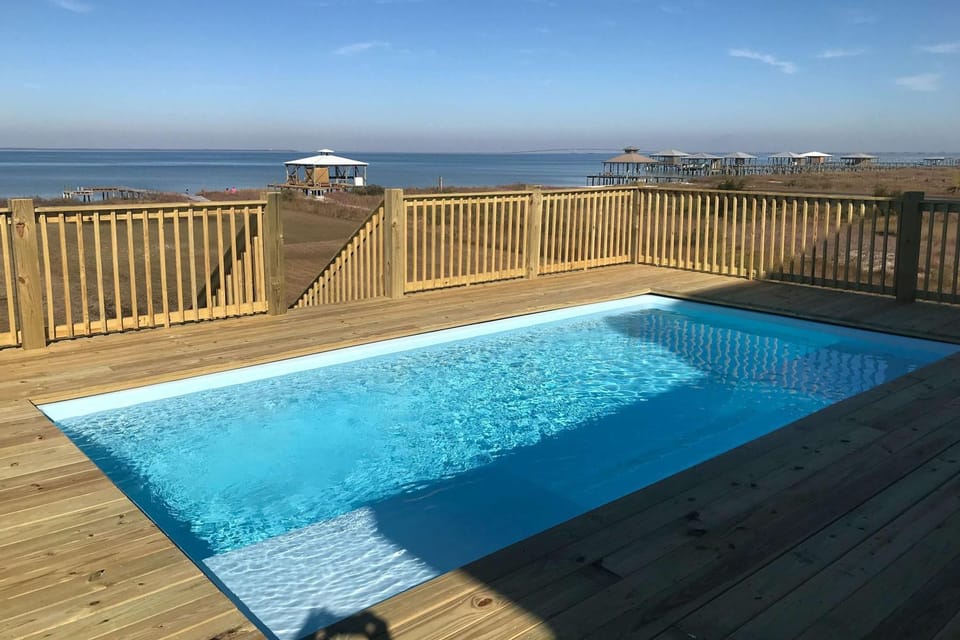Idyllic dog-friendly Bay Front Island home with pool Gulf view & large decks House in Dauphin Island