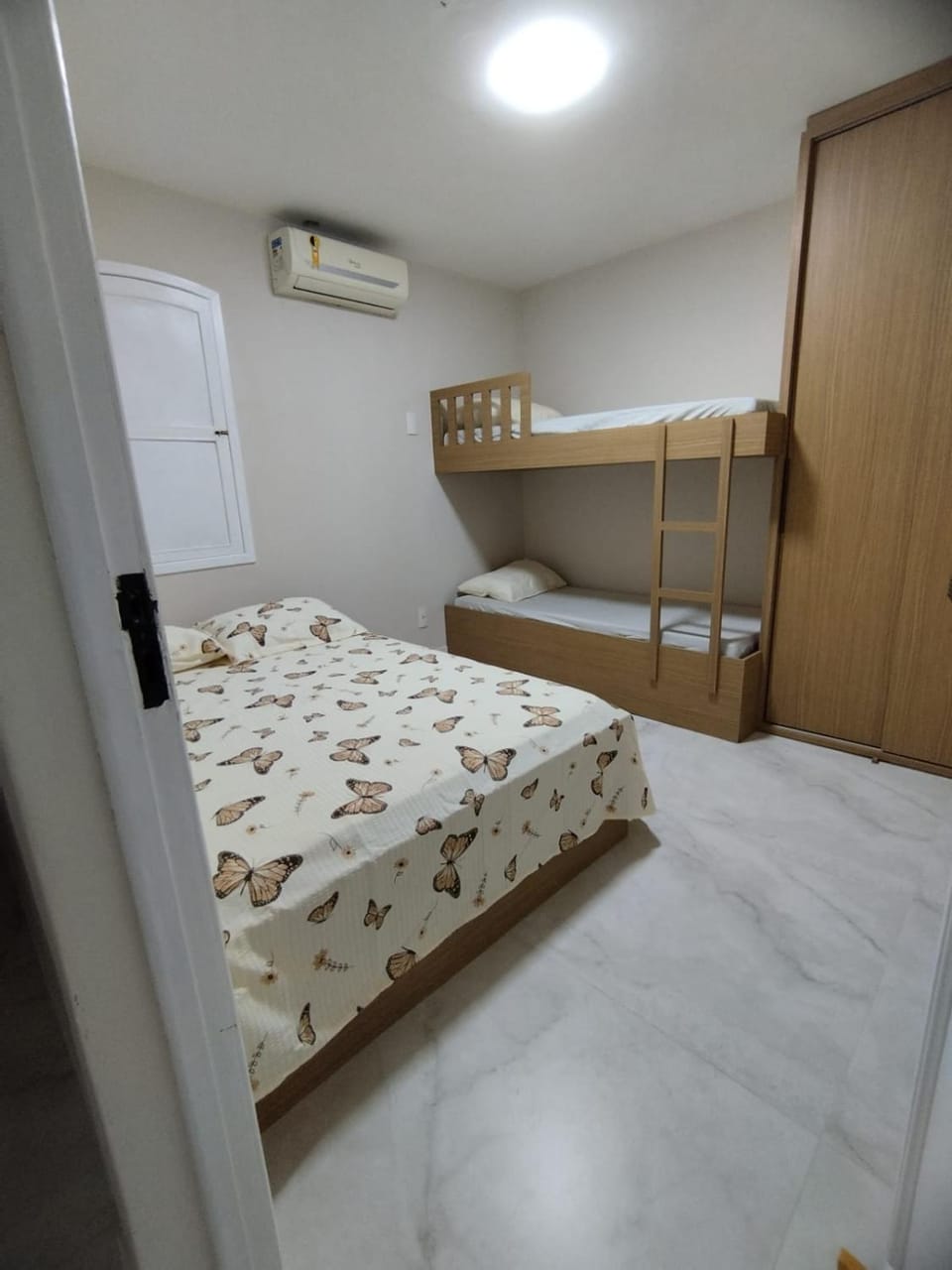 Photo of the whole room, bunk bed, wardrobe, air conditioner