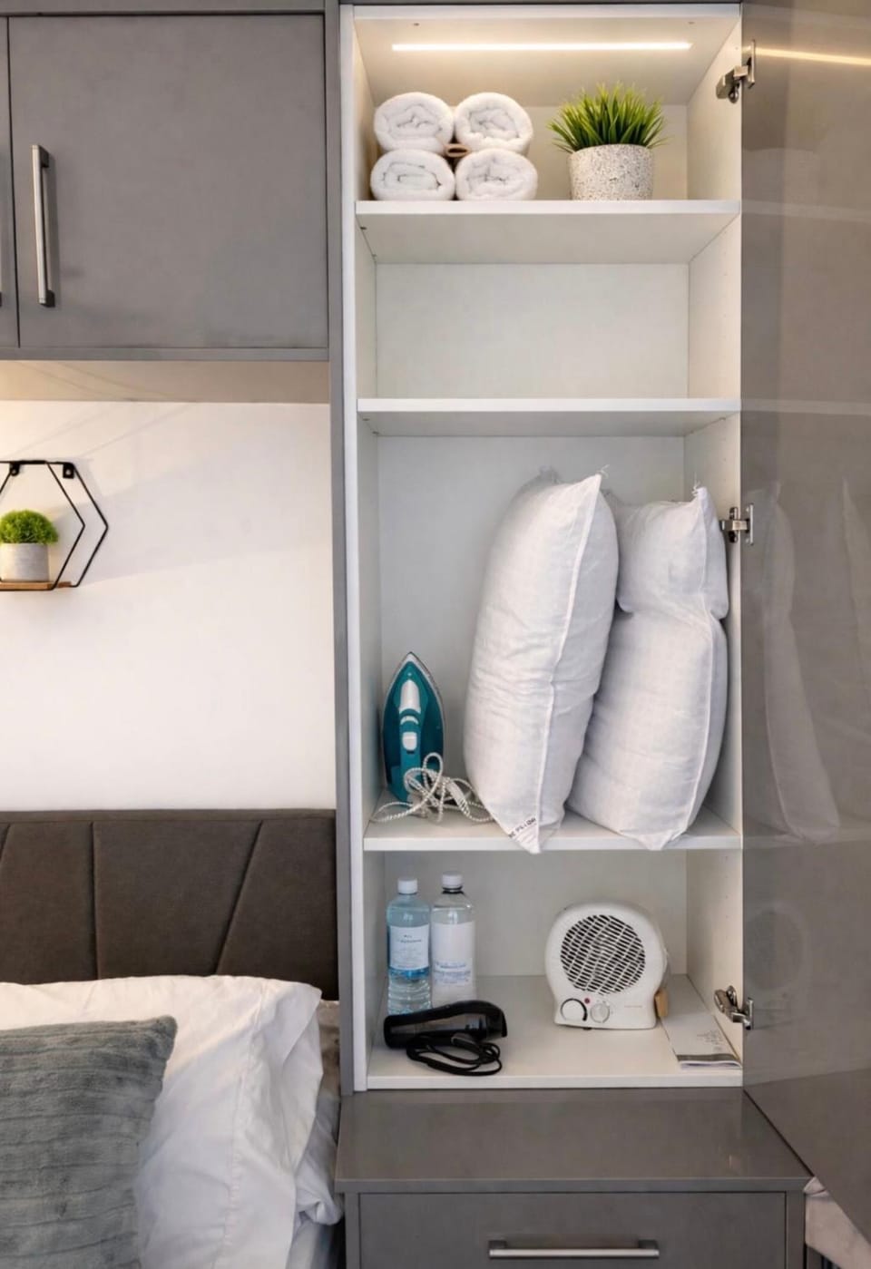 Bed, Decorative detail, Bedroom, flat iron, hair dryier, heating, towels, wardrobe