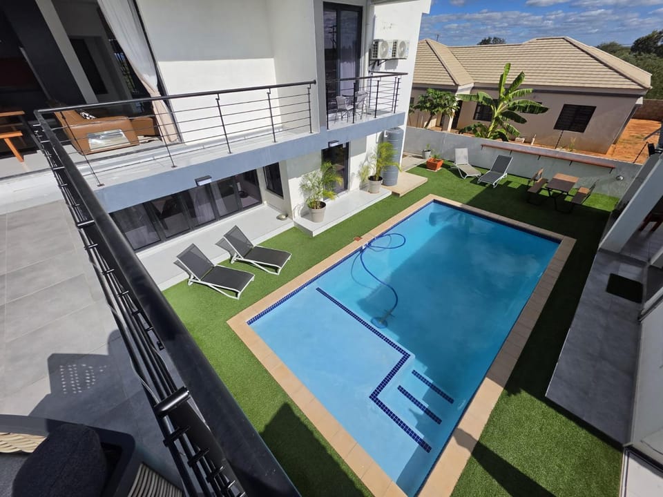 Property building, Pool view, Swimming pool, sunbed