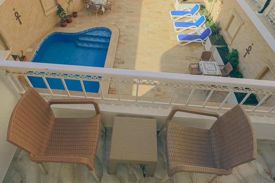 Patio, View (from property/room), Balcony/Terrace, Living room, Seating area, Pool view, Swimming pool, sunbed