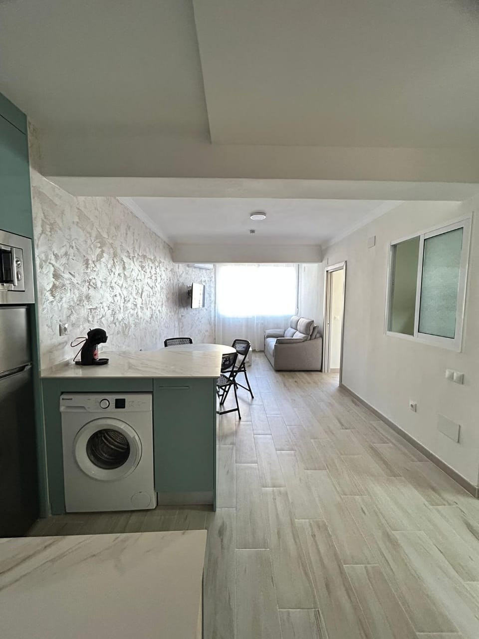Kitchen or kitchenette, washing machine
