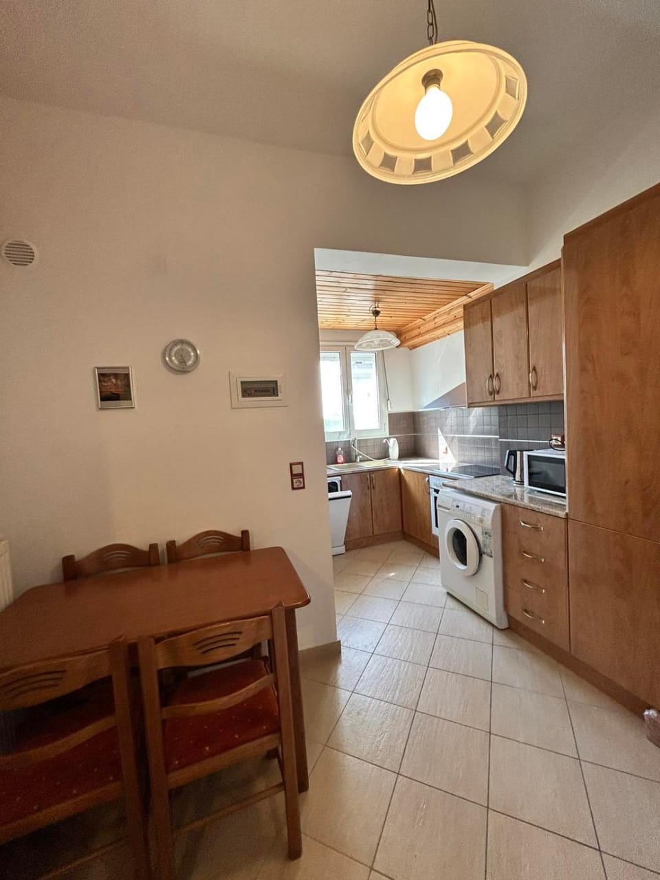 Kitchen or kitchenette, dishwasher, stove, washing machine
