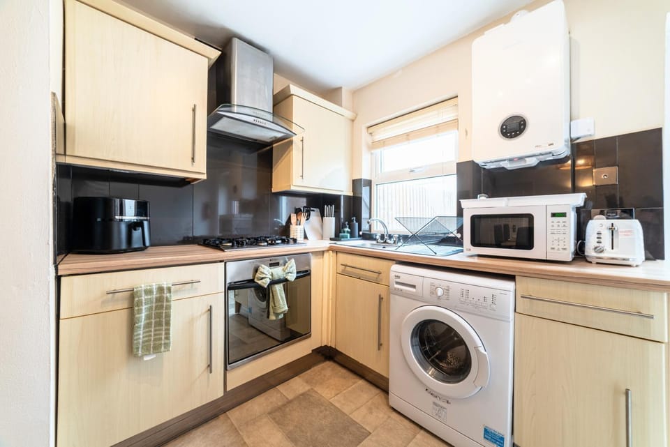 microwave, oven, stove, toaster, washing machine, kitchen