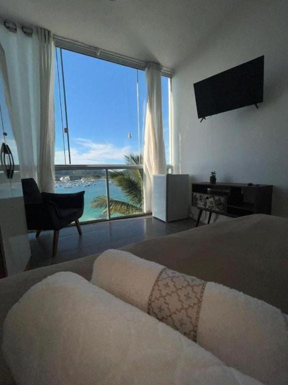 Communal lounge/ TV room, Bed, Natural landscape, TV and multimedia, Living room, Photo of the whole room, Seating area, Evening entertainment, Bedroom, Lake view, River view, Swimming pool