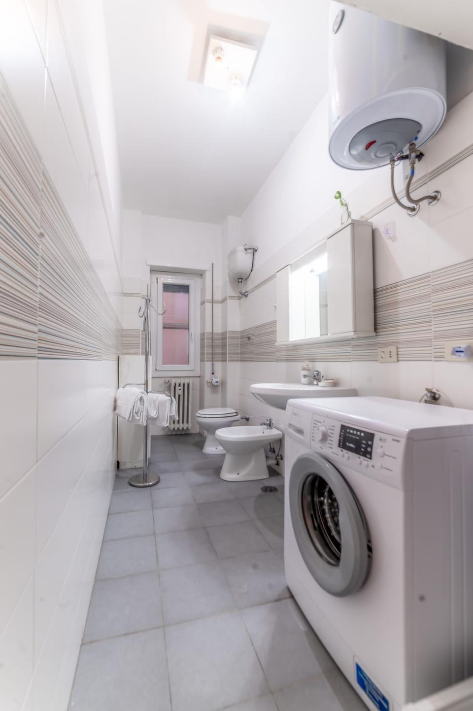 Shower, Toilet, Bathroom, hair dryier, towels, washing machine