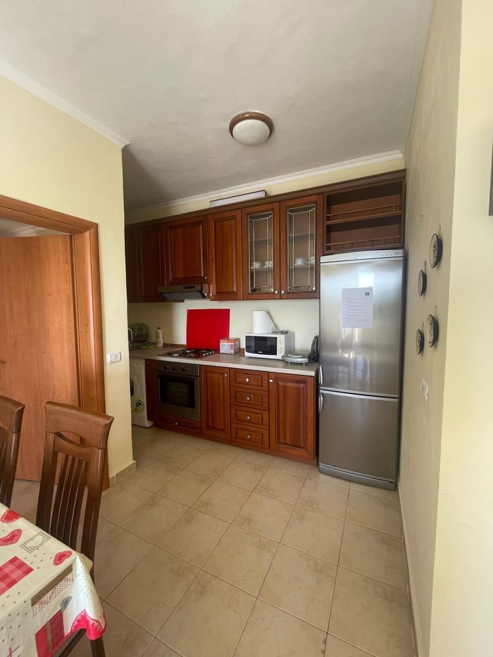 Kitchen or kitchenette, Dining area, microwave, oven, stove, toaster, washing machine