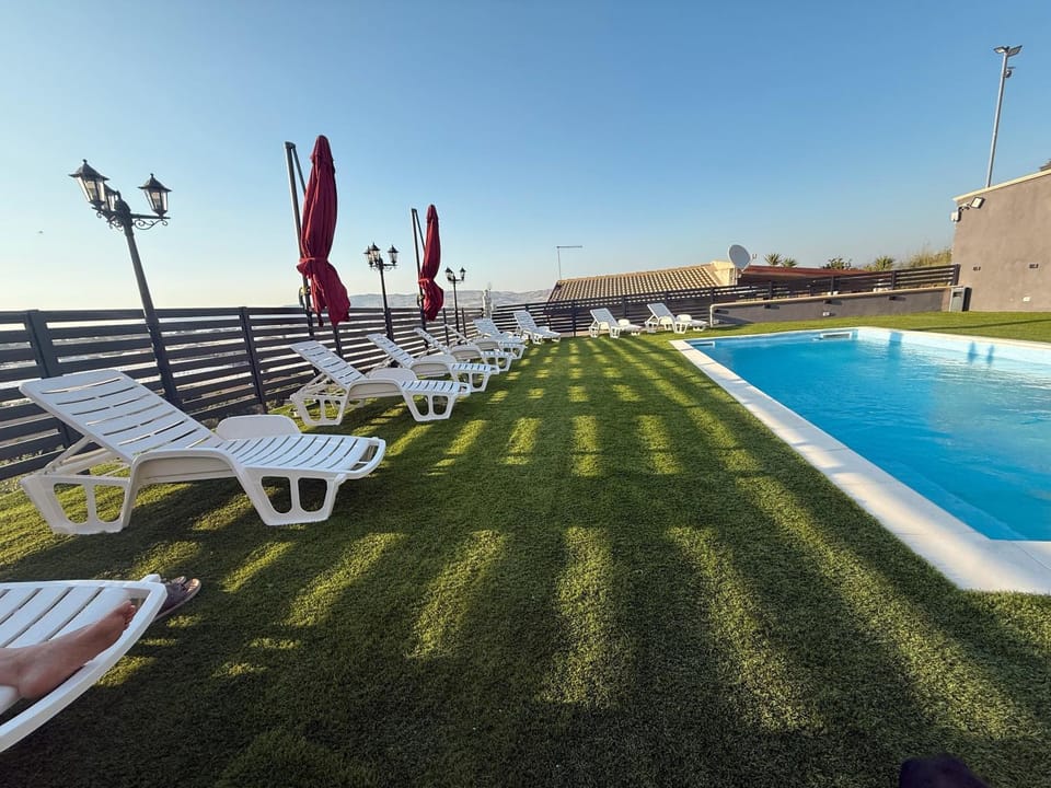 Property building, Living room, Swimming pool