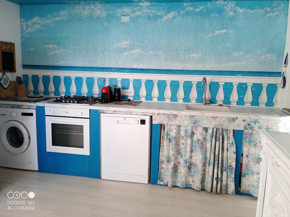 Kitchen or kitchenette, dishwasher, oven, stove, washing machine