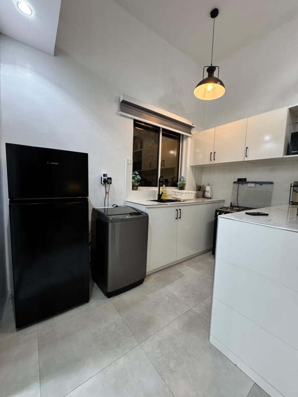 Kitchen or kitchenette, washing machine