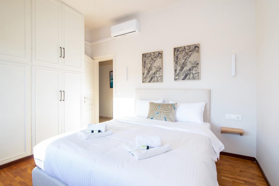 Bed, Photo of the whole room, Decorative detail, Bedroom, towels, wardrobe, air conditioner