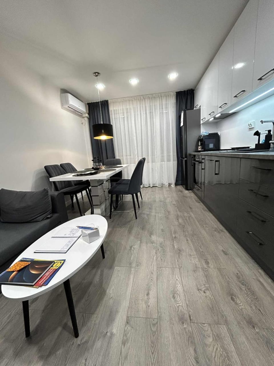 Kitchen or kitchenette, Living room, Seating area, Dining area, oven, stove, air conditioner