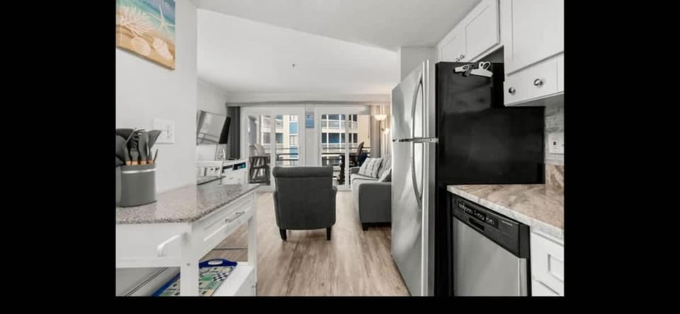 Kitchen or kitchenette, dishwasher, oven, stove