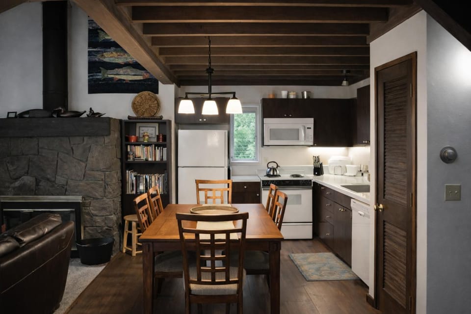 Kitchen or kitchenette, Dining area, fireplace, furniture, microwave, oven, stove