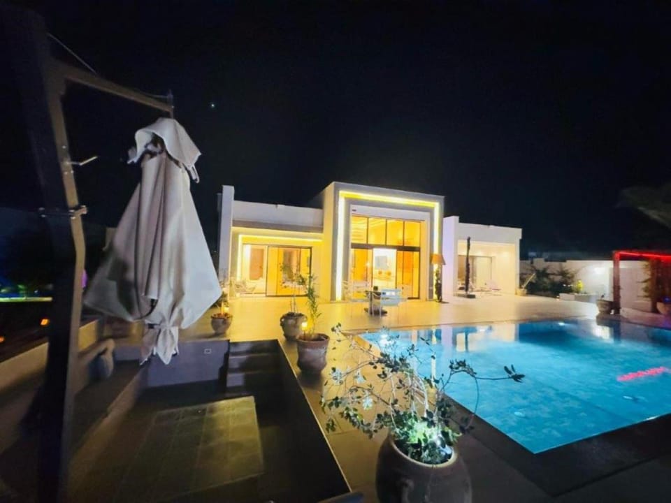 Property building, Patio, Night, Pool view, Swimming pool
