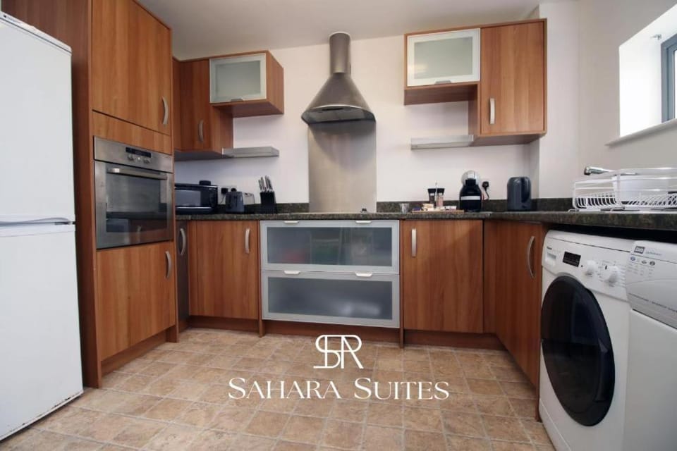 Kitchen or kitchenette, oven, stove, toaster, washing machine, dryer