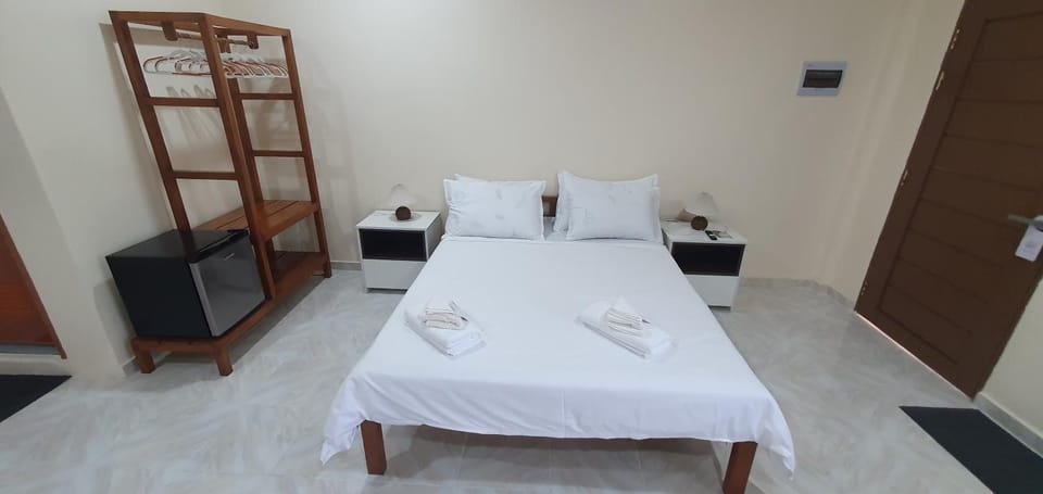 Bed, minibar, wardrobe