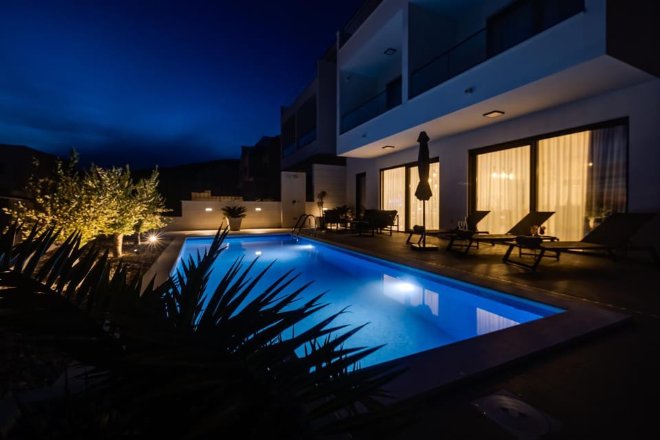 Property building, Patio, Night, Pool view, Swimming pool, sunbed