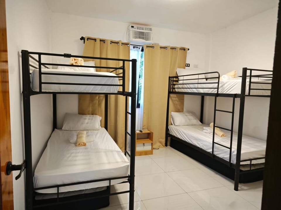 Photo of the whole room, bunk bed, air conditioner