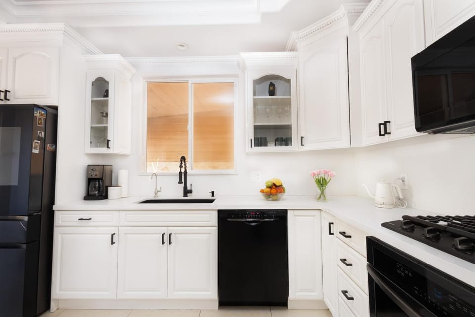 Kitchen or kitchenette, dishwasher, oven, stove