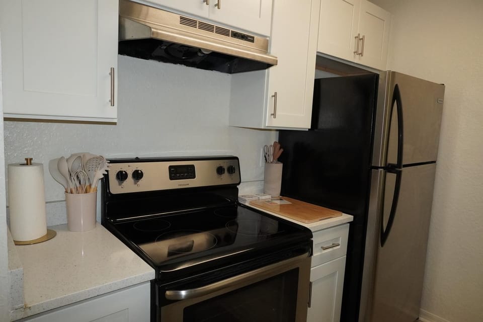 Kitchen or kitchenette, dishwasher, oven, stove, toaster