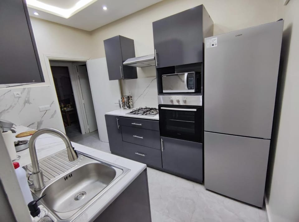 Kitchen or kitchenette, microwave, oven, stove, kitchen
